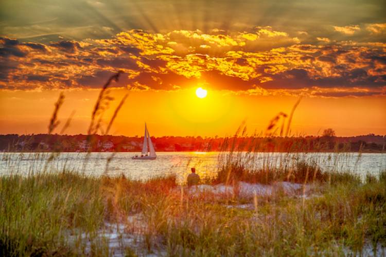 sunset with sailboat on water